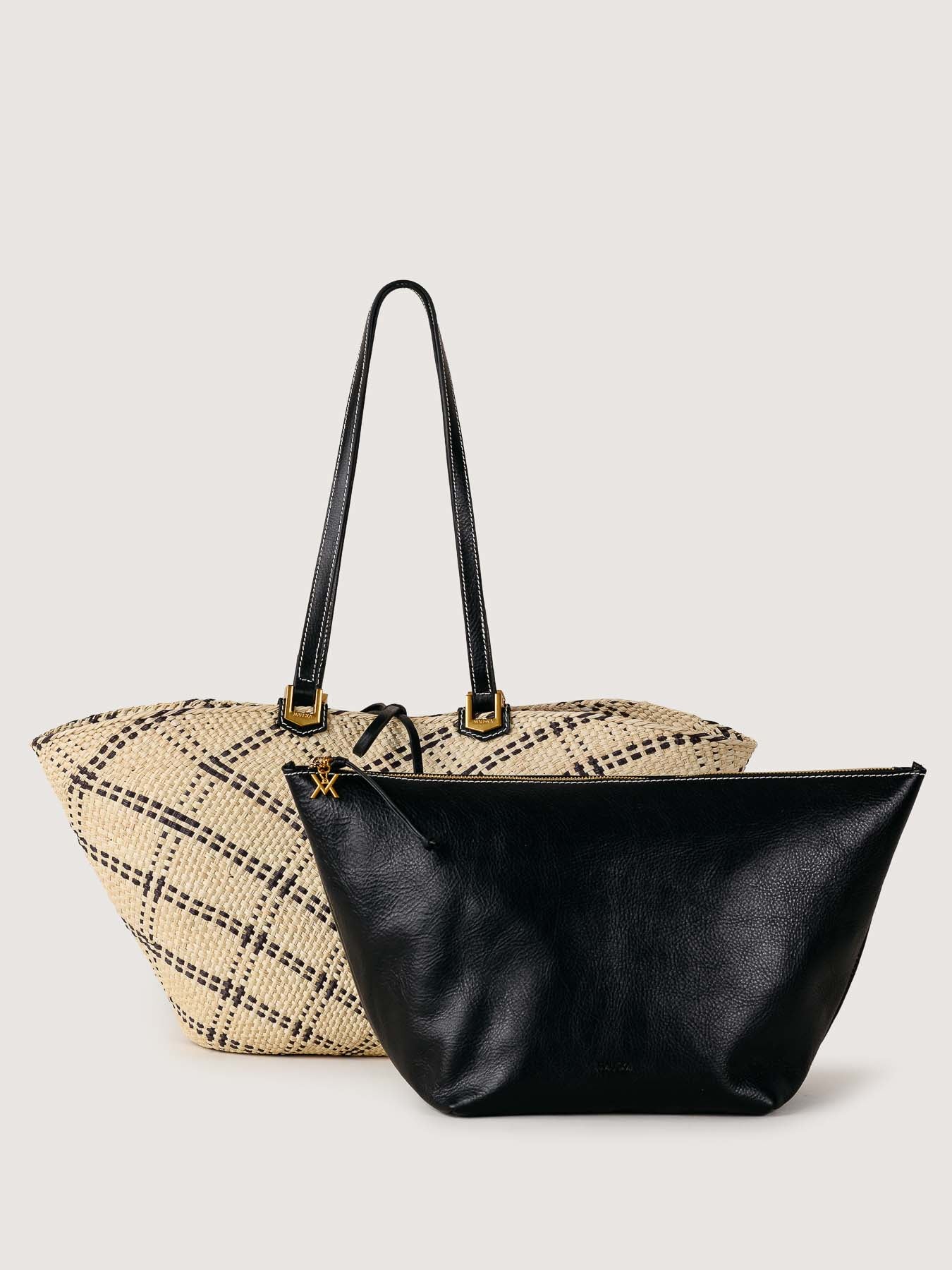 The tote and pouch placed side by side, highlighting contrast and balance.