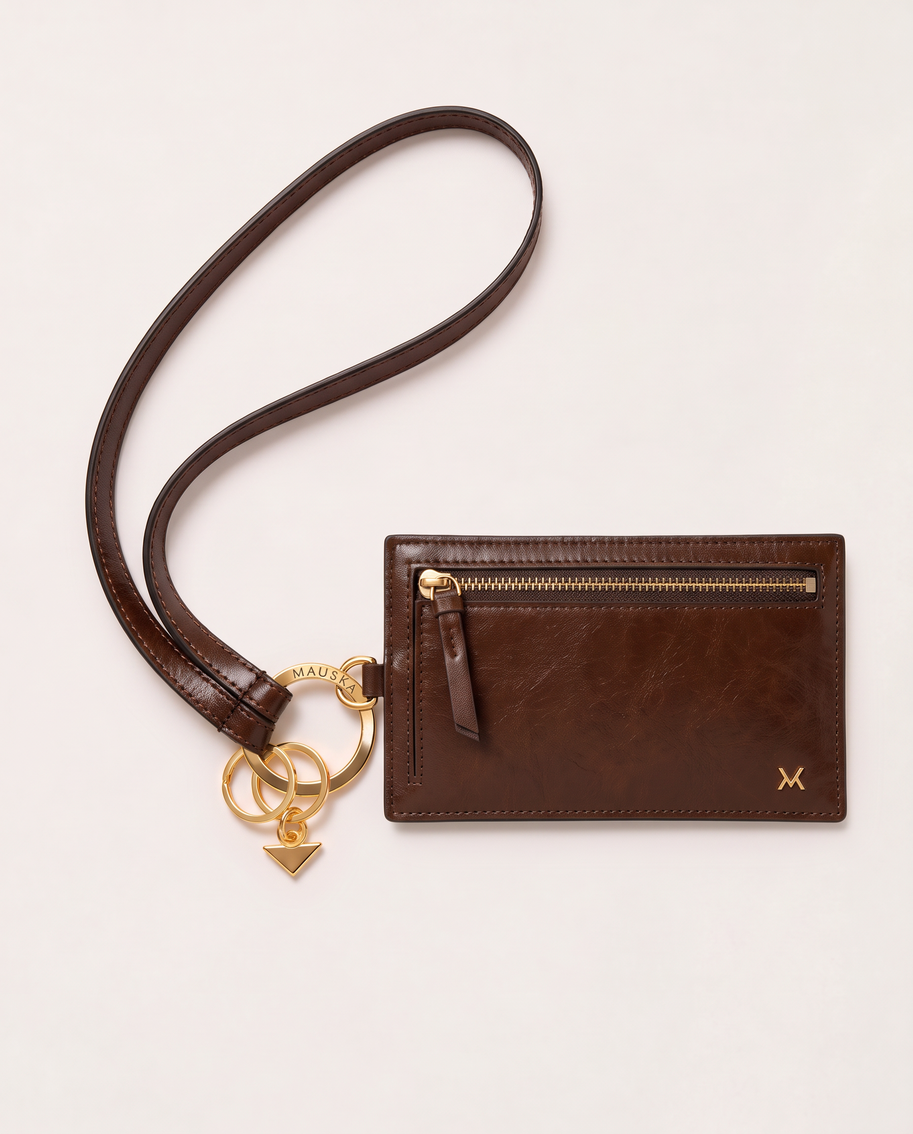MAUSKA ARO tobacco leather key holder attached to the matching ARO wallet with gold-tone hardware.