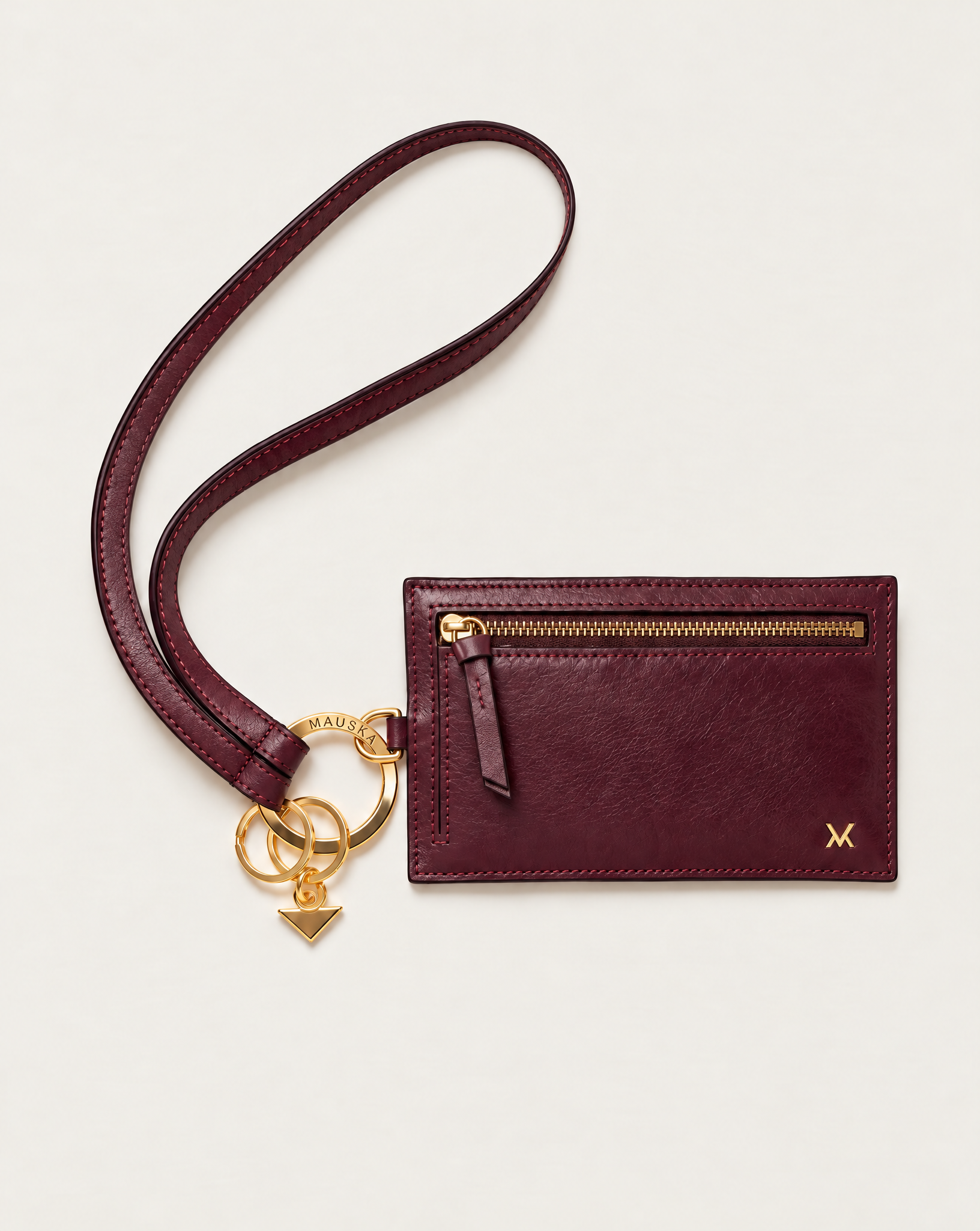 MAUSKA ARO burgundy leather key holder attached to the matching ARO wallet with gold-tone hardware.