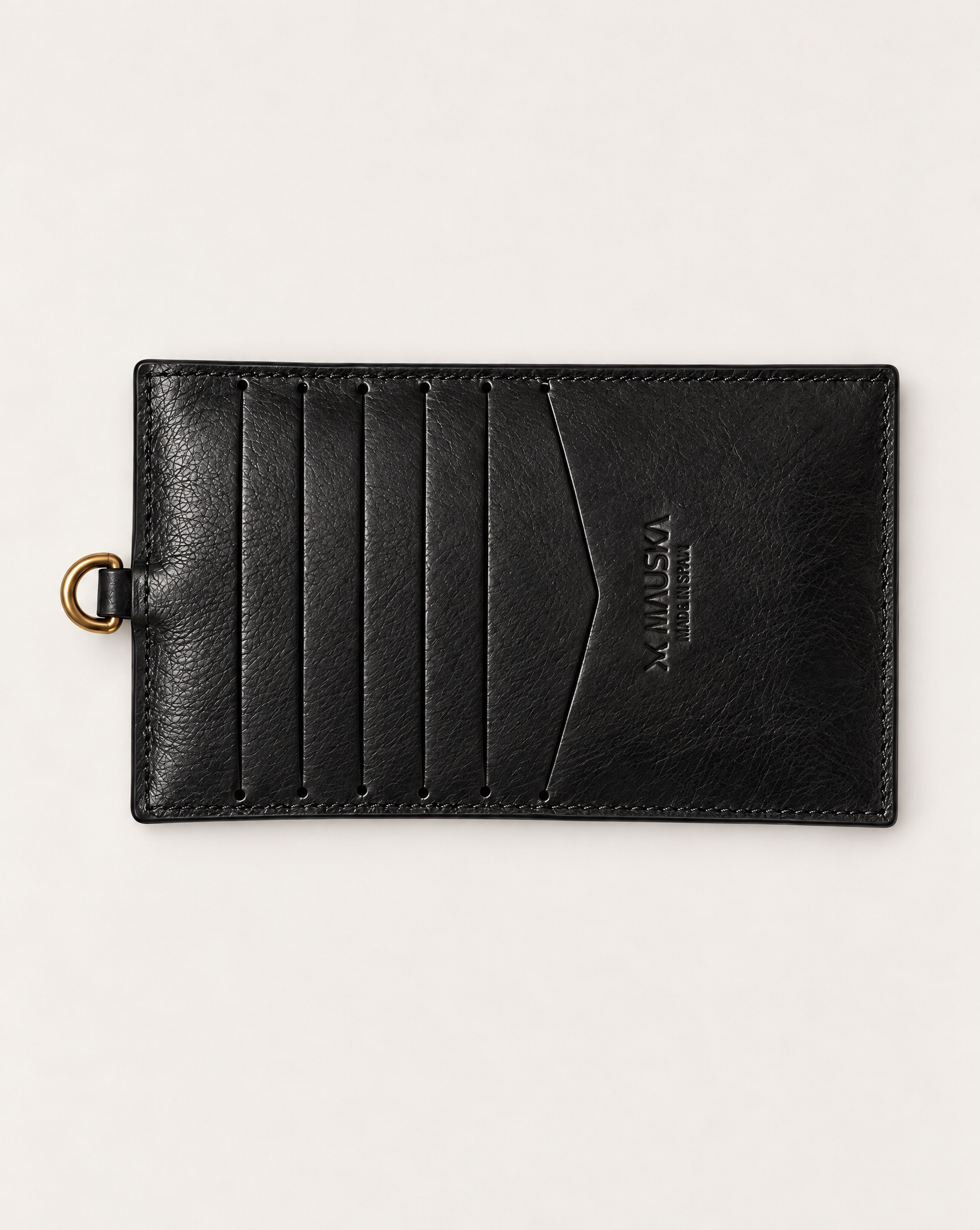 Back view of MAUSKA ARO black vegetable-tanned leather wallet with multiple card slots and embossed MAUSKA logo.