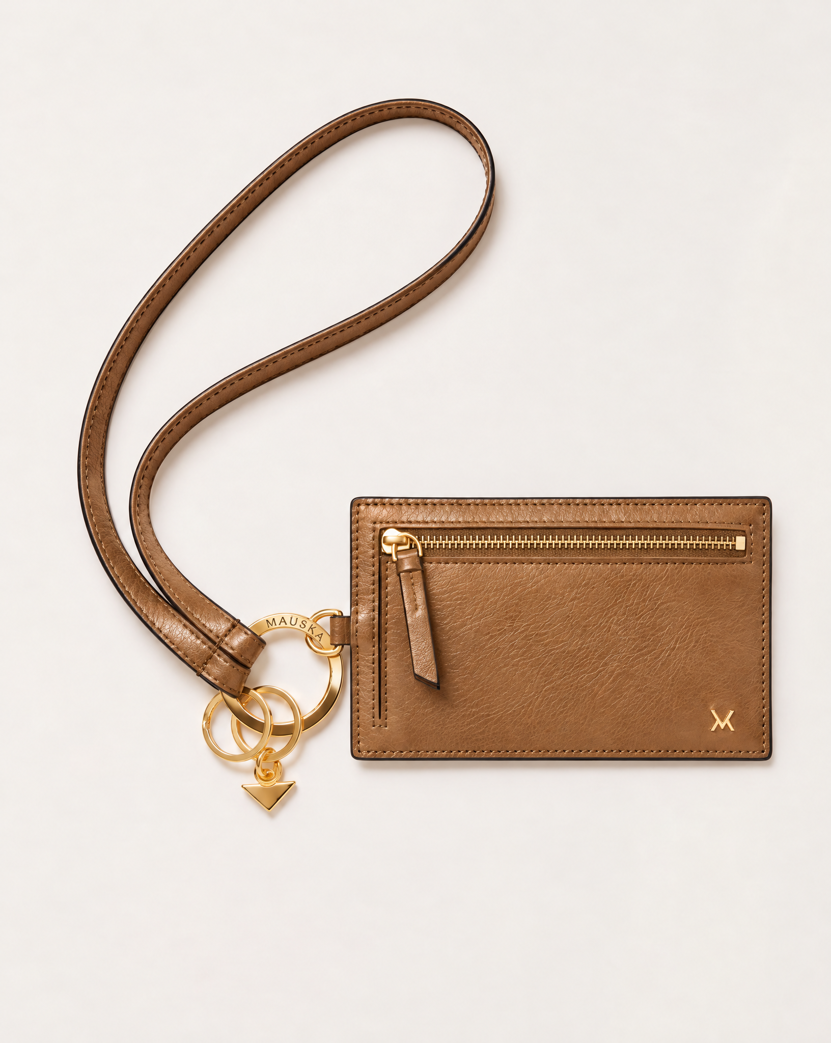 MAUSKA ARO natural leather wallet attached to the matching ARO leather key holder with gold-tone circular clasp.