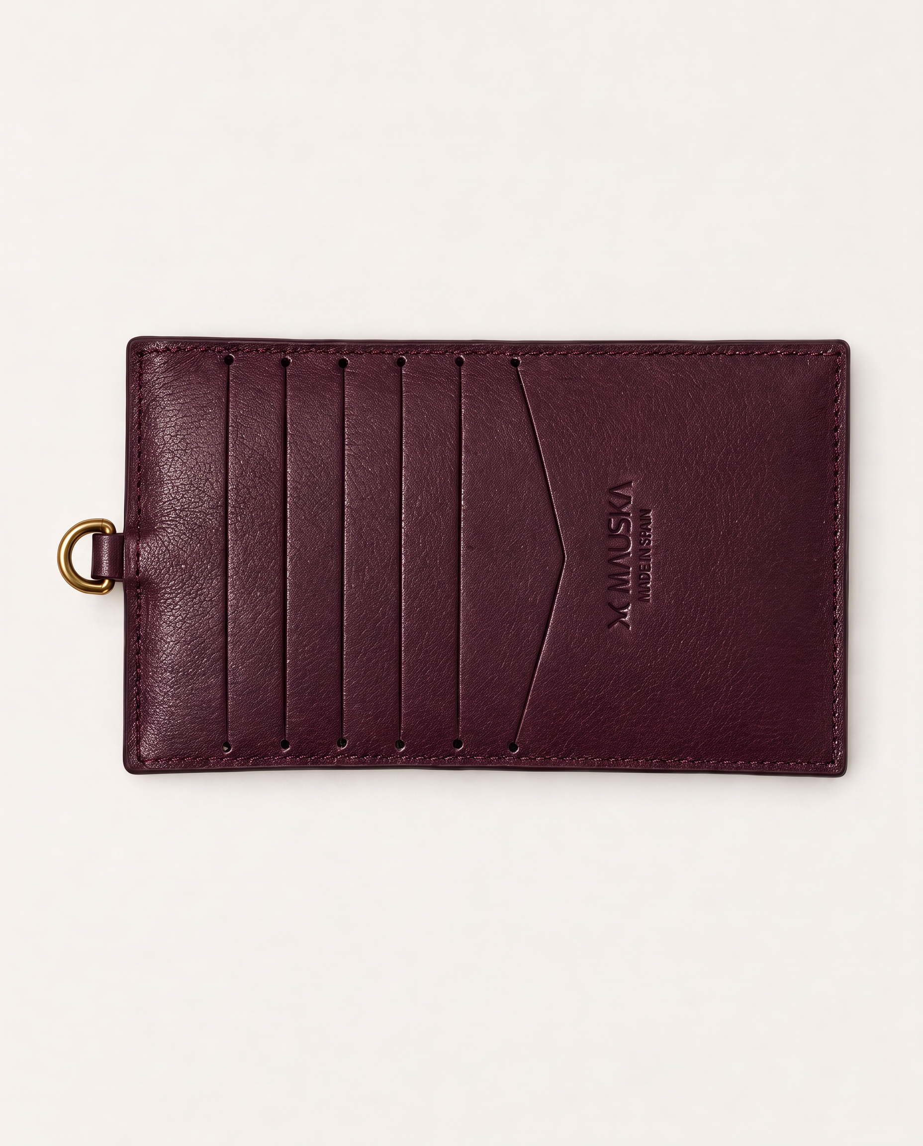 Back view of MAUSKA ARO burgundy vegetable-tanned leather wallet with multiple card slots and embossed MAUSKA logo.