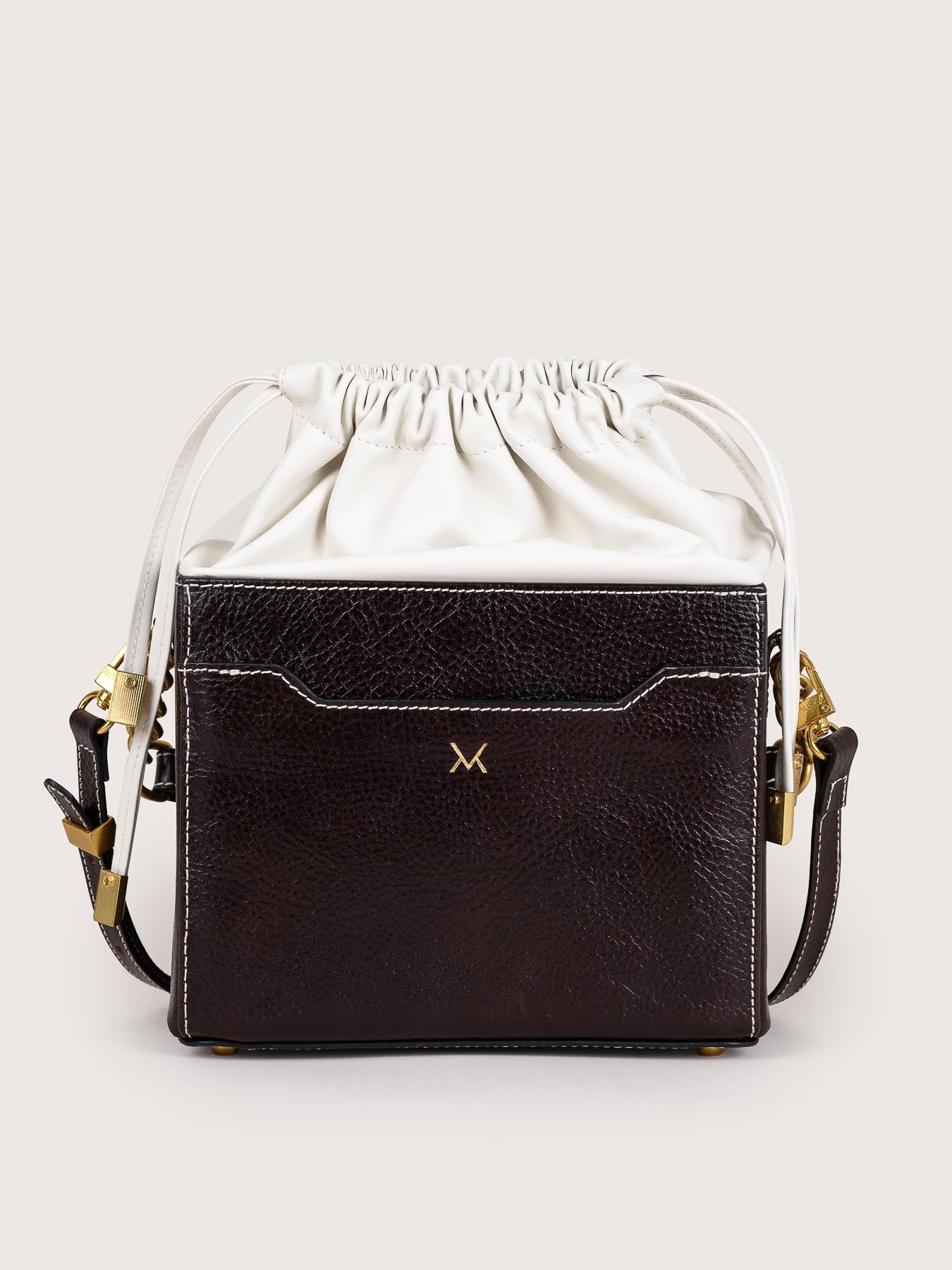 Rear view of the Colombo black and white leather bag by Mauska. A high-end leather accessory designed in San Sebastián and handcrafted in the workshops of Ubrique, Spain. Highlights the premium leather texture and contemporary designer silhouette.