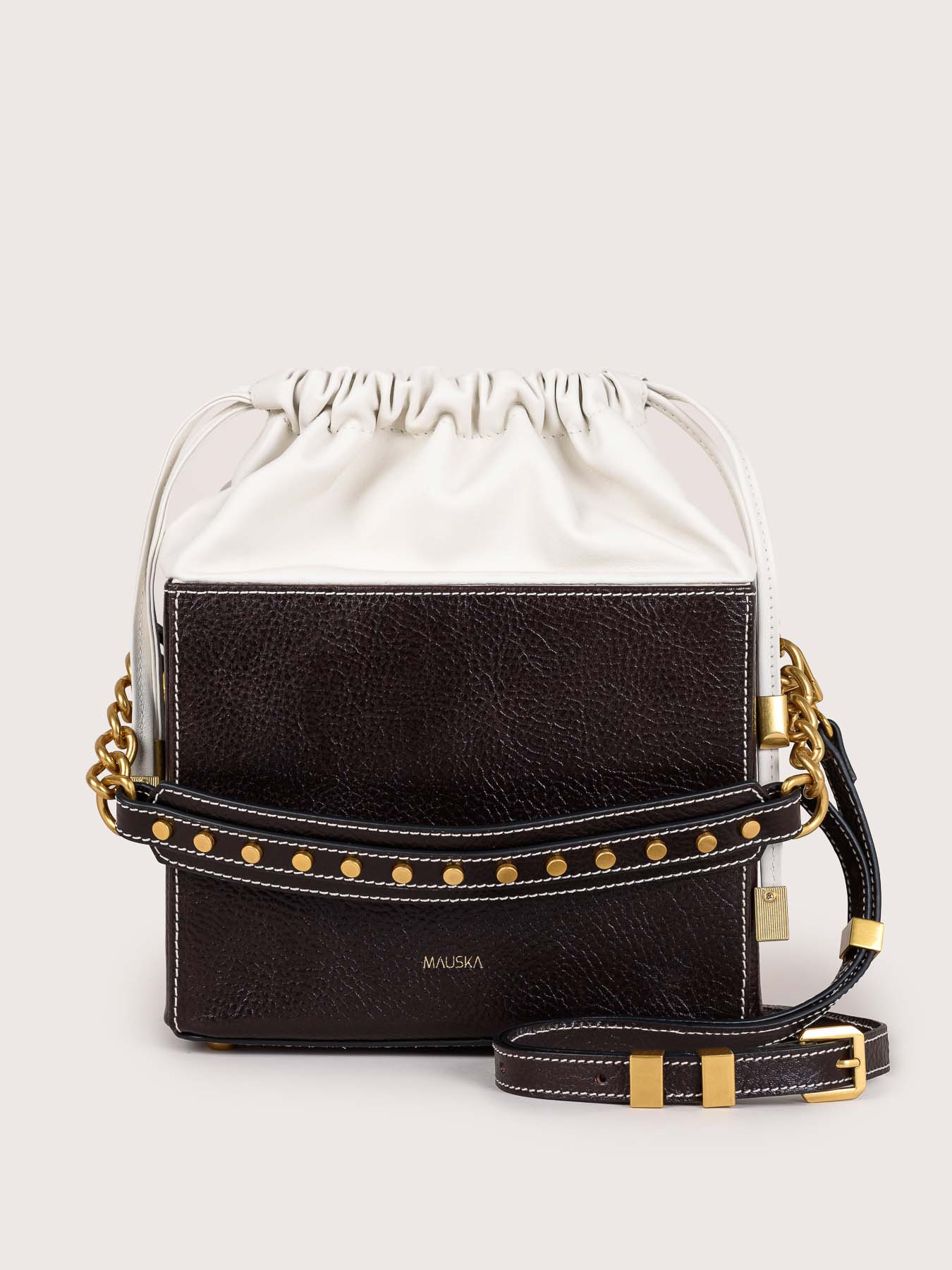 Front view of the Colombo black and white suede leather bag by Mauska, handcrafted in Ubrique, Spain. Premium suede texture, contemporary designer silhouette, minimalist luxury accessory inspired by timeless understated elegance