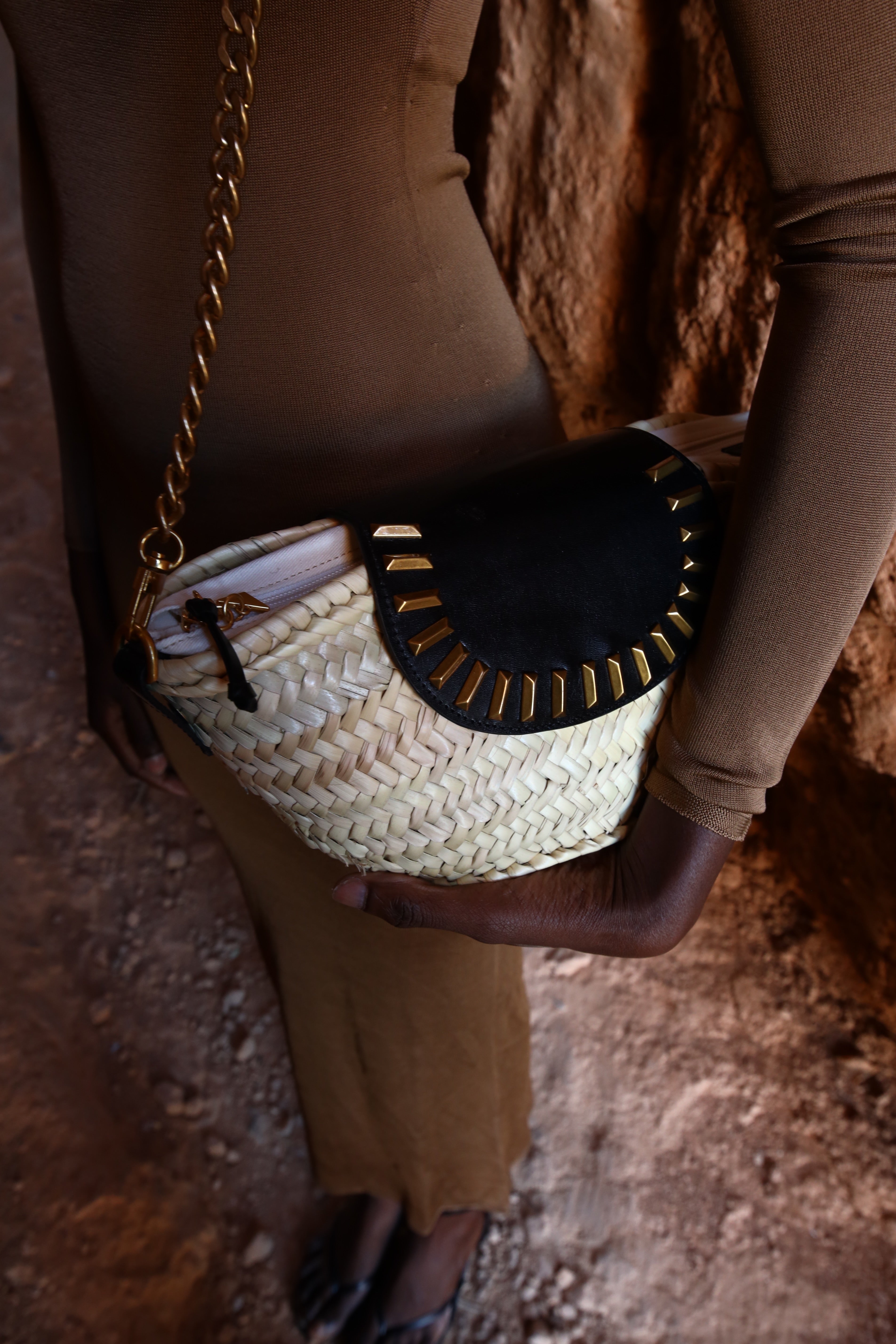 Majorelle black studded basket bag worn on model by Mauska. Designed in San Sebastián and handcrafted in Ubrique, Spain. Defined by texture and contemporary design.