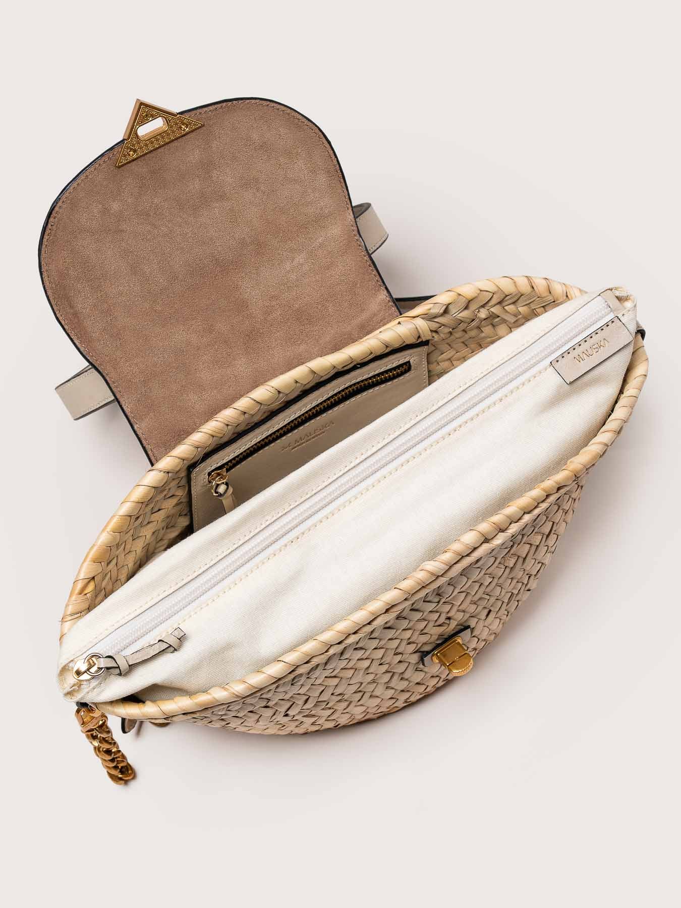 Interior view of the Majorelle basket bag in ivory leather with handle by Mauska. Designed in San Sebastián and handcrafted in Ubrique, Spain. Defined by texture and contemporary design.