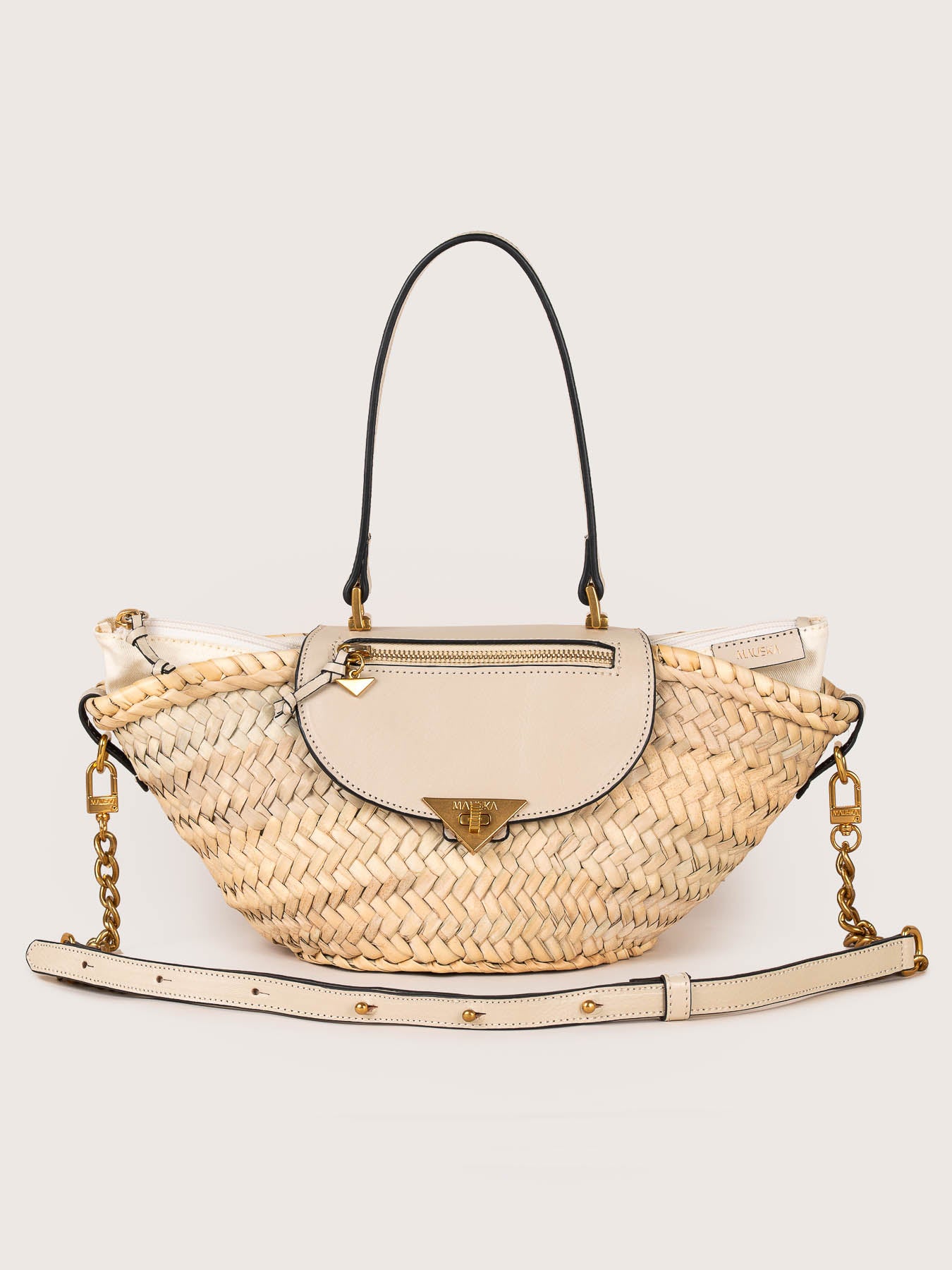Front view of the Majorelle basket bag in ivory leather with handle by Mauska. Designed in San Sebastián and handcrafted in Ubrique, Spain. Defined by texture and contemporary design.