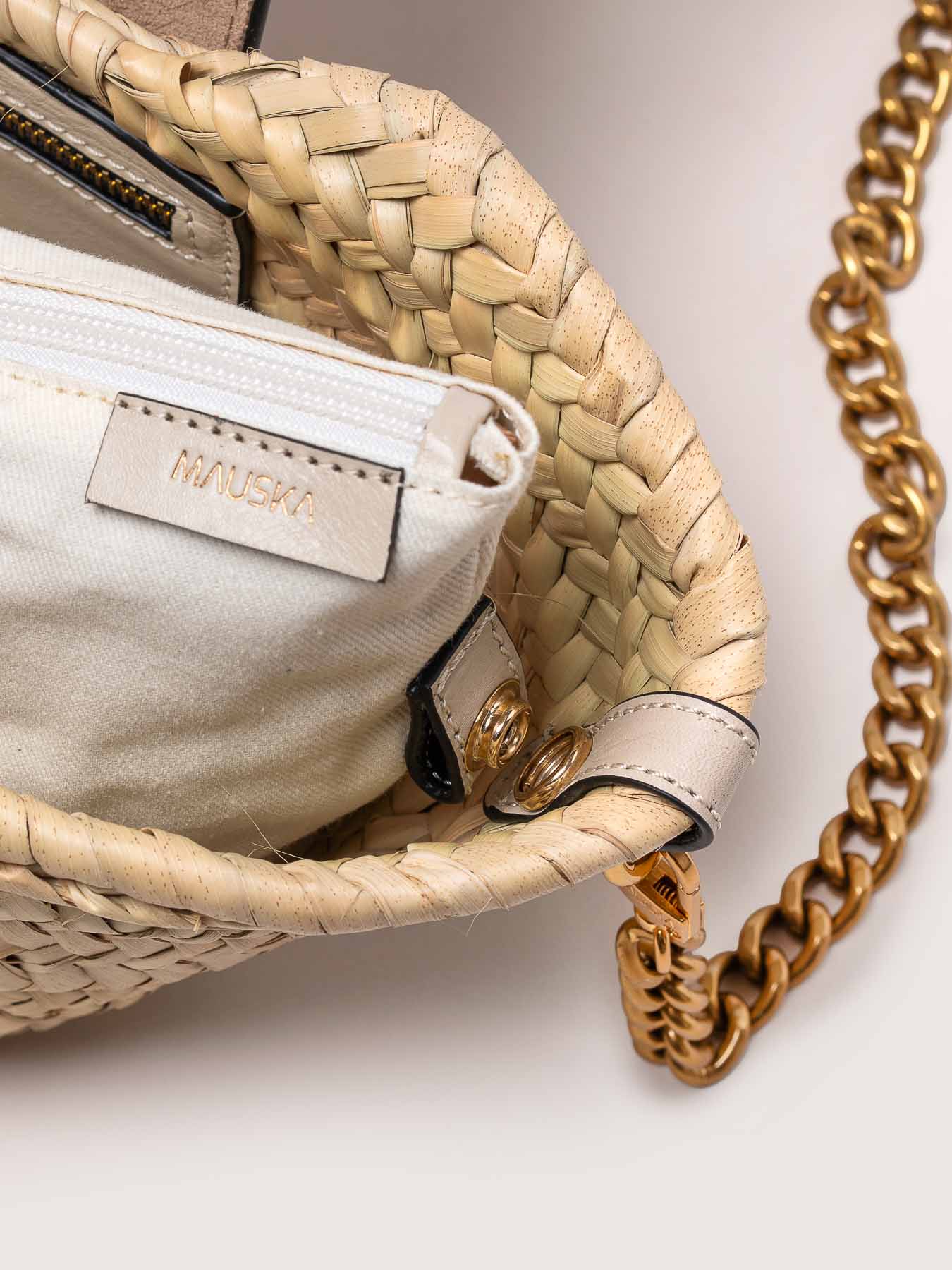 Interior view of the Majorelle studded basket bag in ivory leather by Mauska. Designed in San Sebastián and handcrafted in Ubrique, Spain. Highlighting its refined texture and contemporary design.
