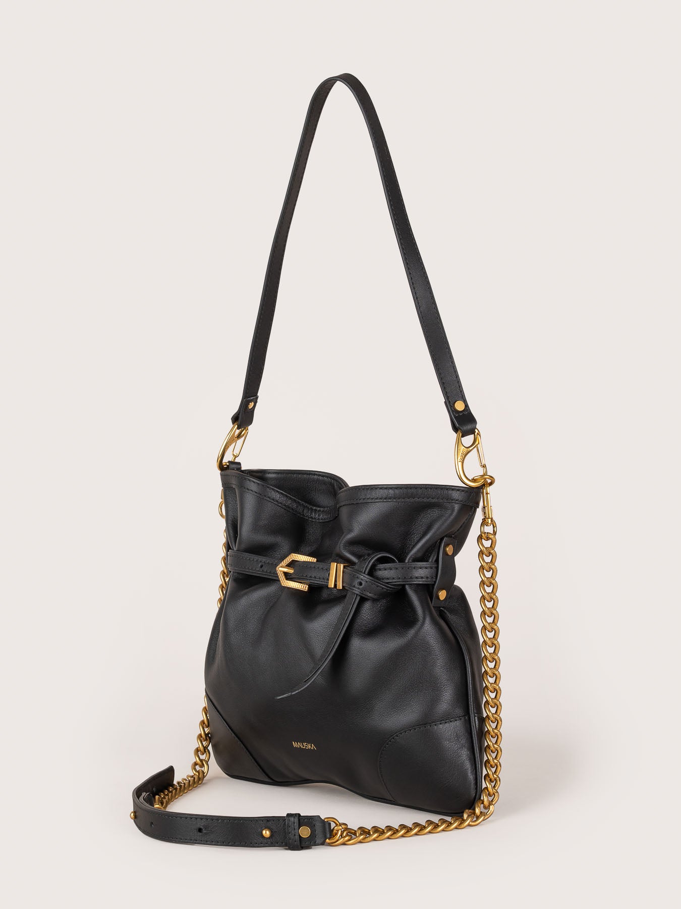 Side profile of the Pereira Mini bag in black suede leather by Mauska. Designed in San Sebastián and handcrafted in Ubrique, Spain. Defined by texture and contemporary design.