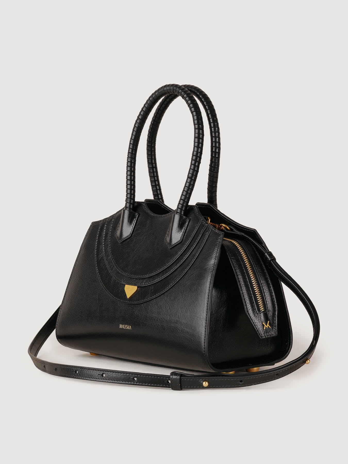 Black Rosario leather bag side view, handcrafted in Spain