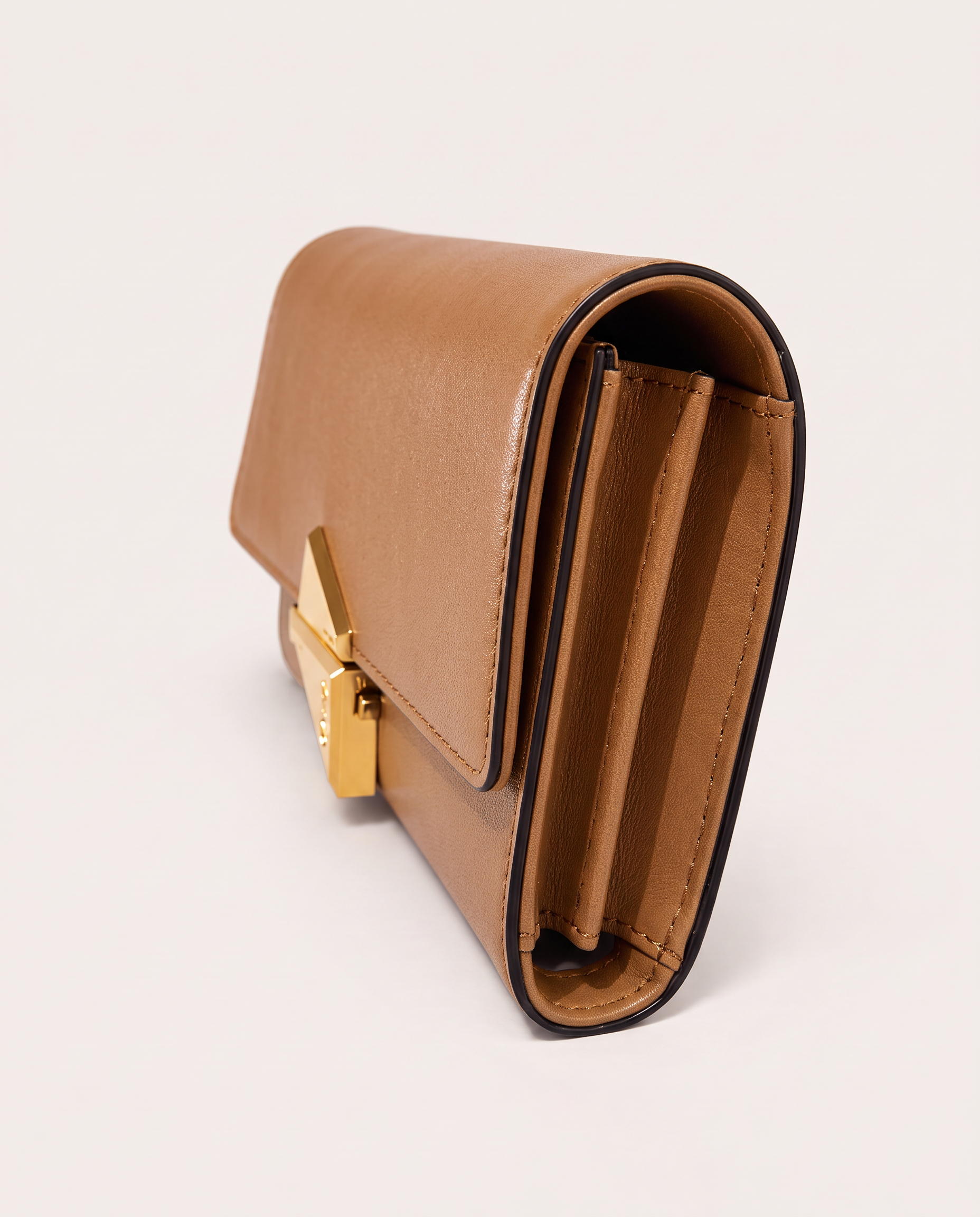 Side view of the VEGA natural leather clutch bag by MAUSKA