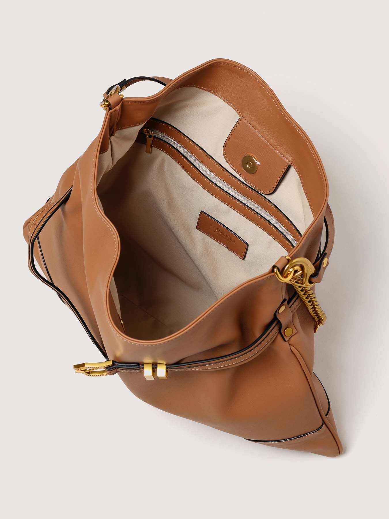 Interior of Pereira Maxi habana leather bag with functional compartments.