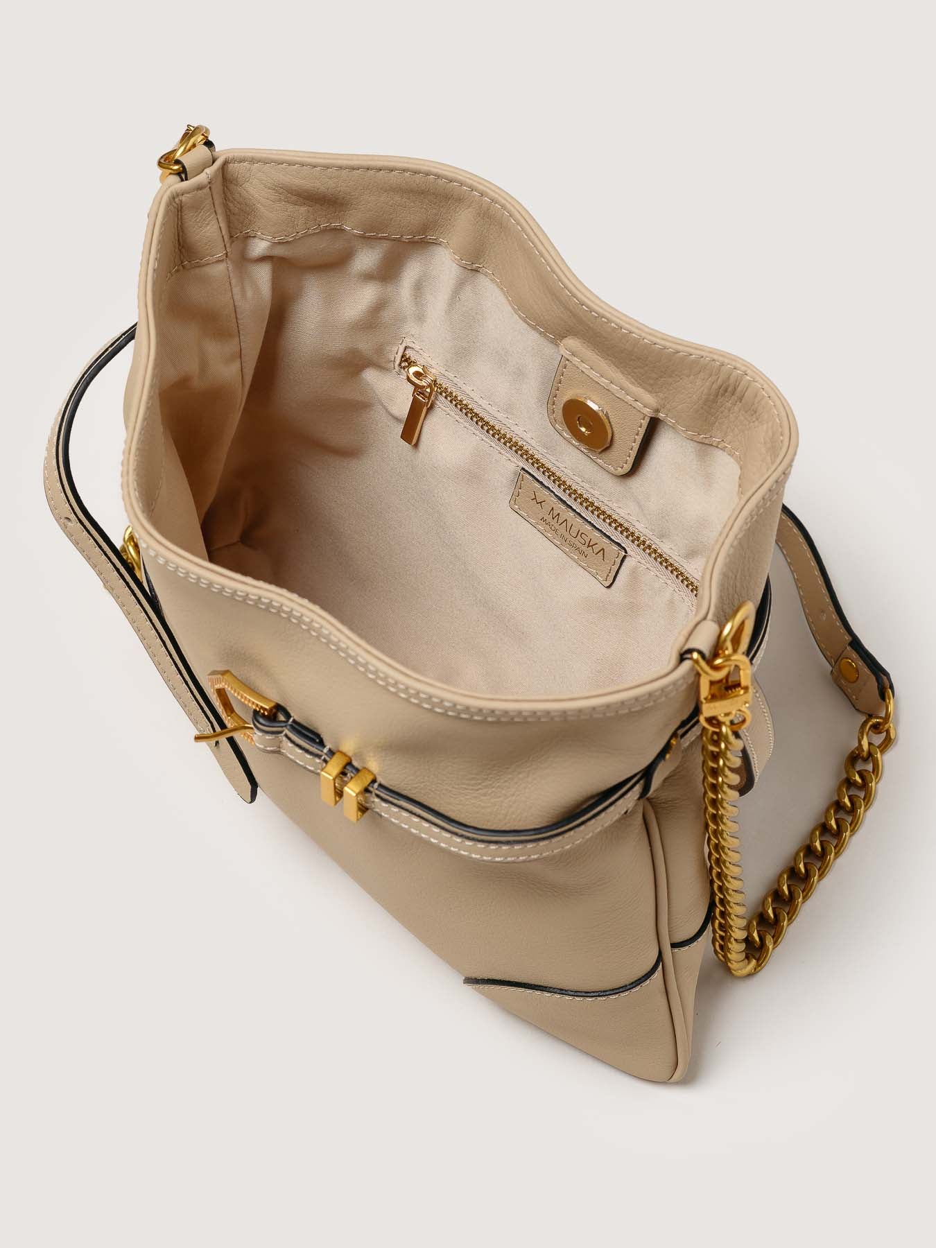 Interior of Pereira Mini beige leather bag with functional compartments