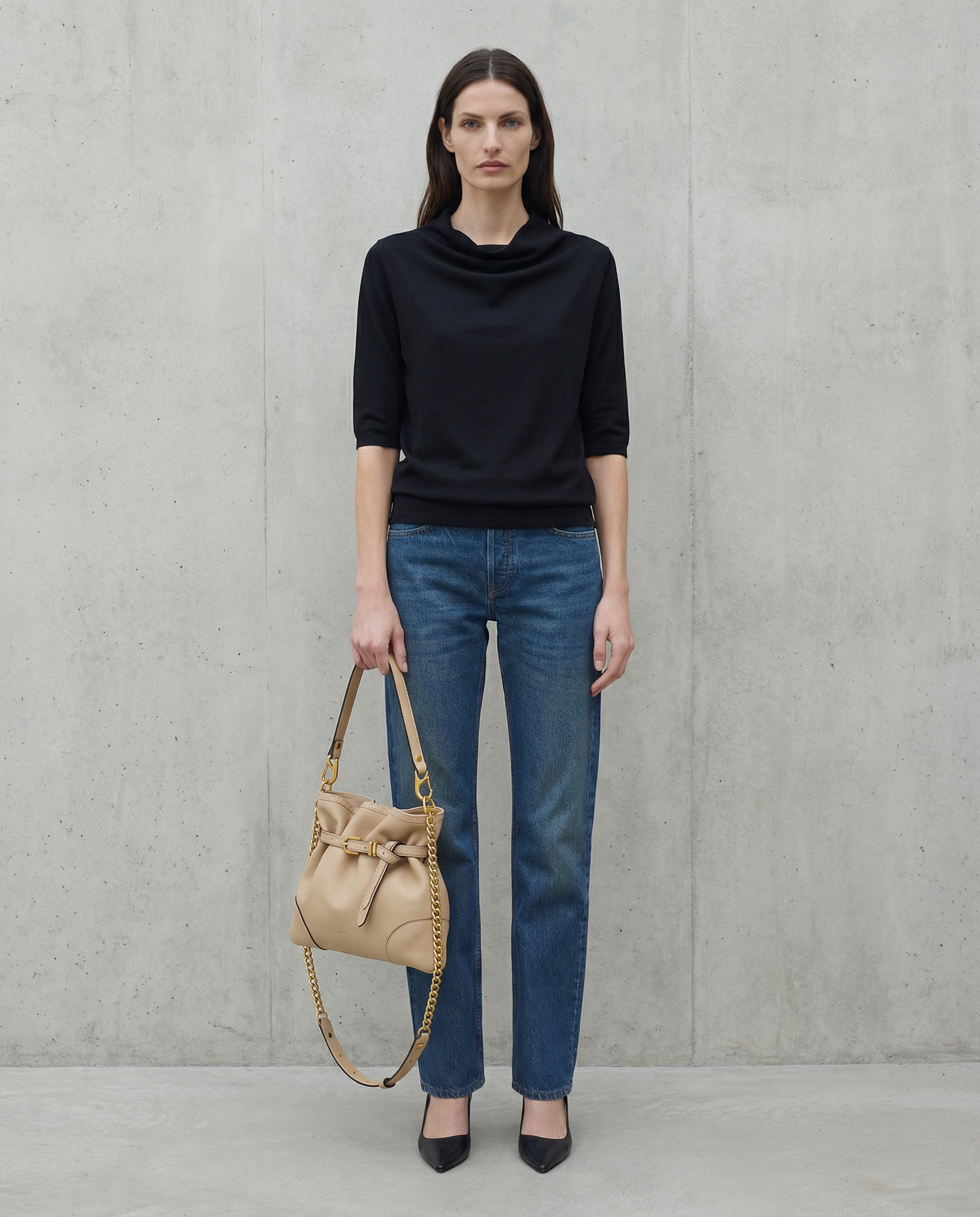 Pereira Mini beige leather bag worn by model, showing scale and fit.