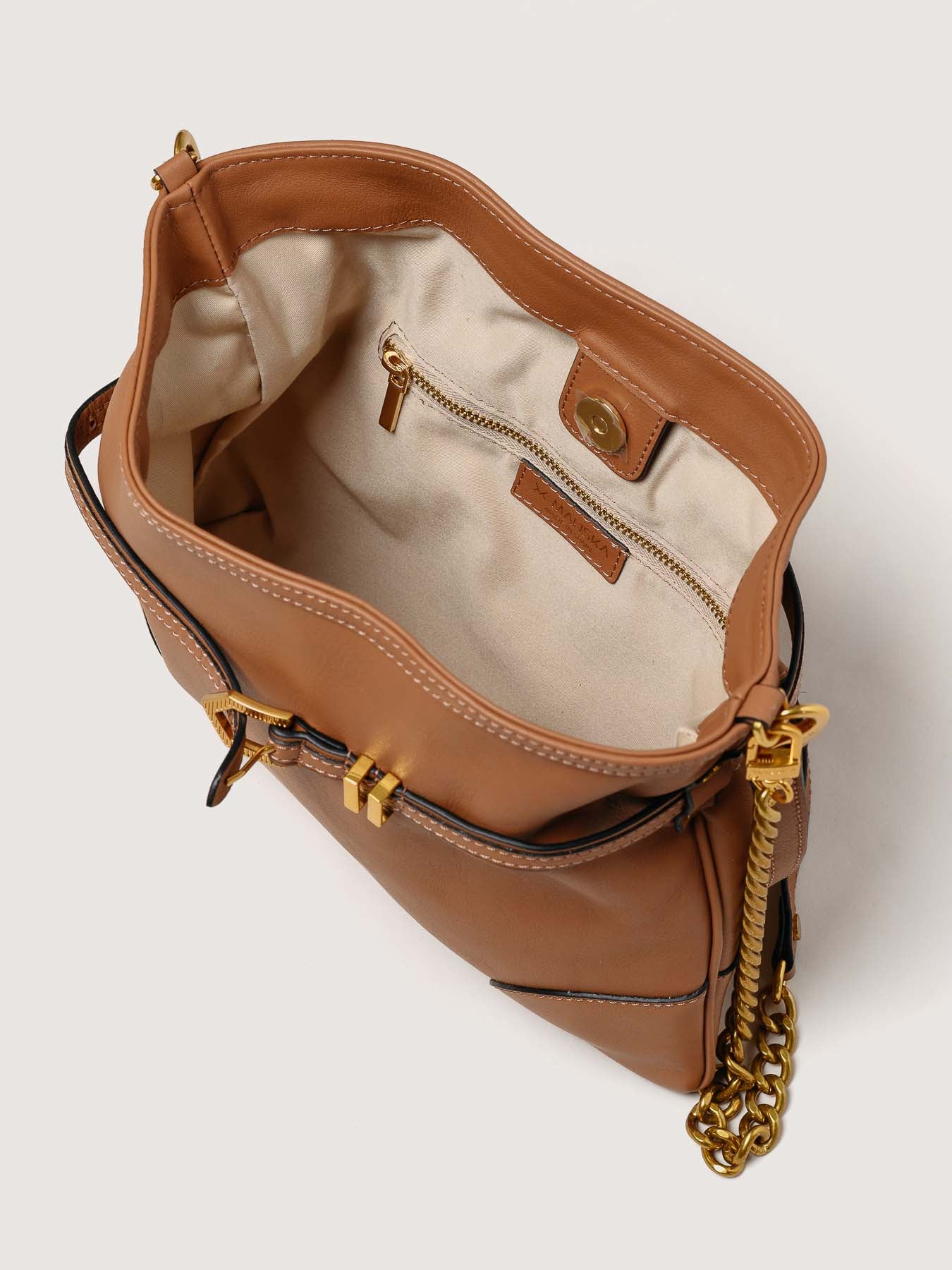 Interior of Pereira Mini habana leather bag with functional compartments.