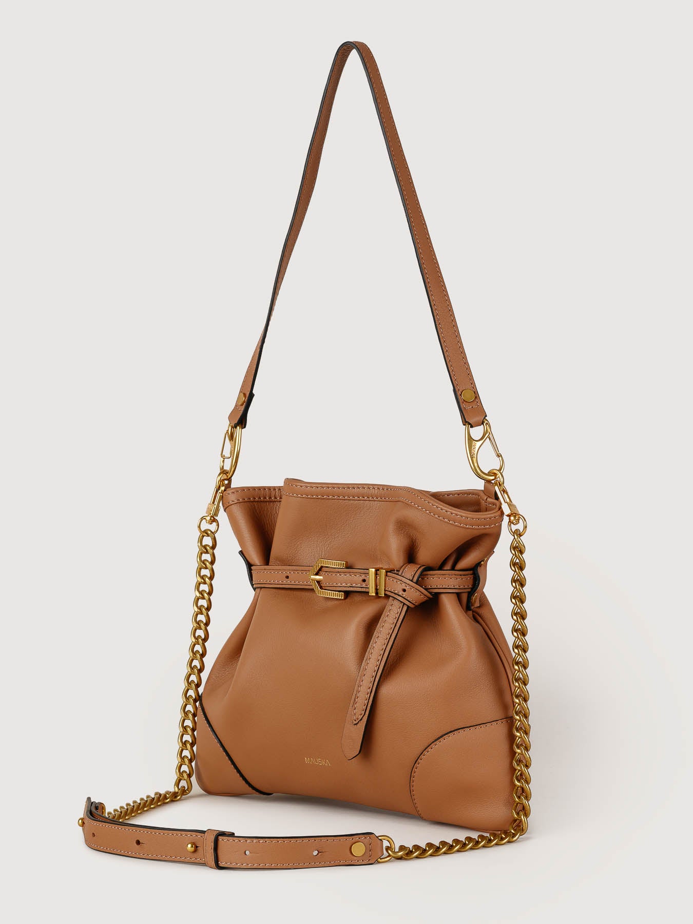Side view of Pereira Mini habana leather bag showing its structured silhouette.