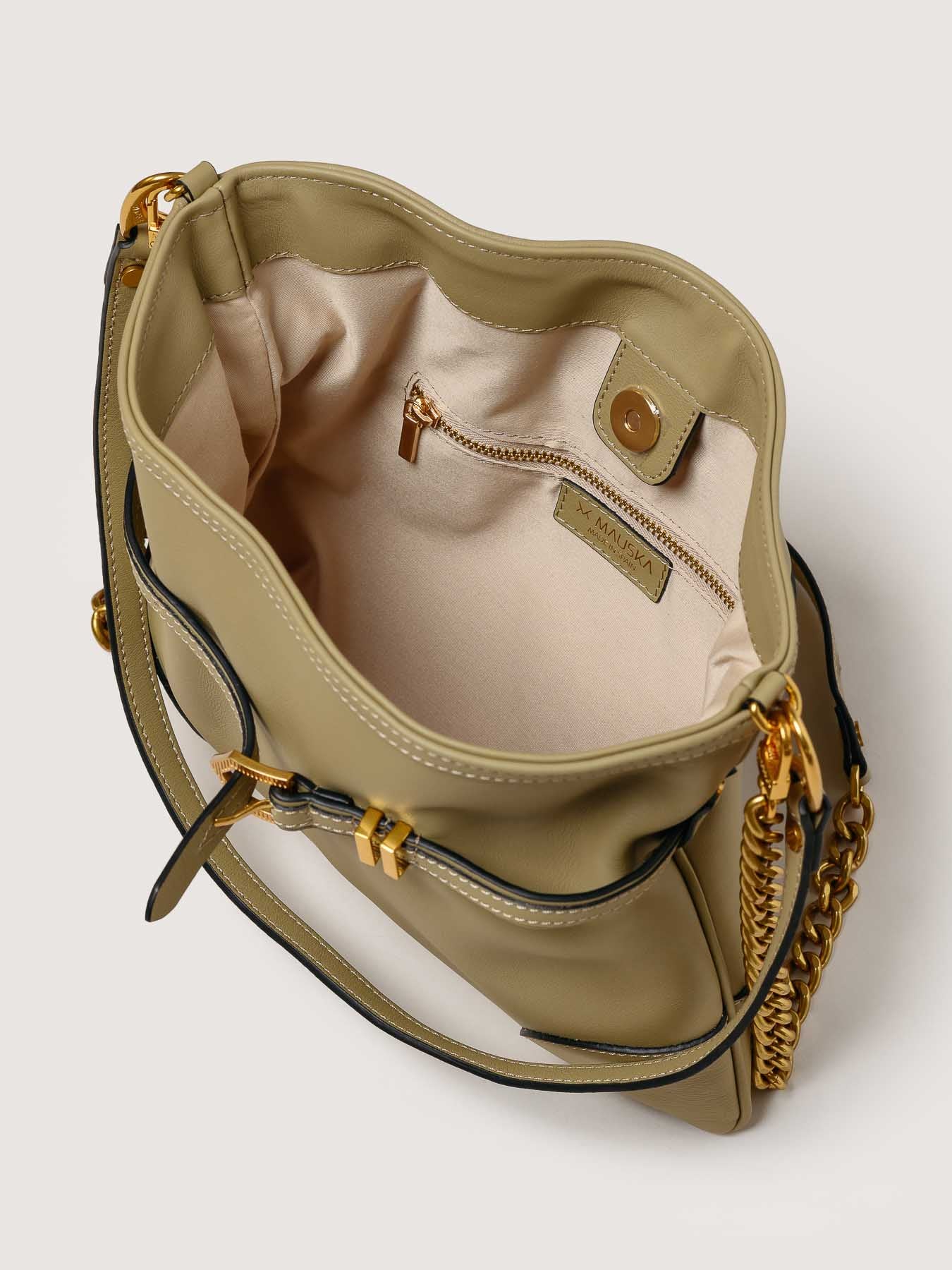 Interior of Pereira Mini light olive leather bag with functional compartments.