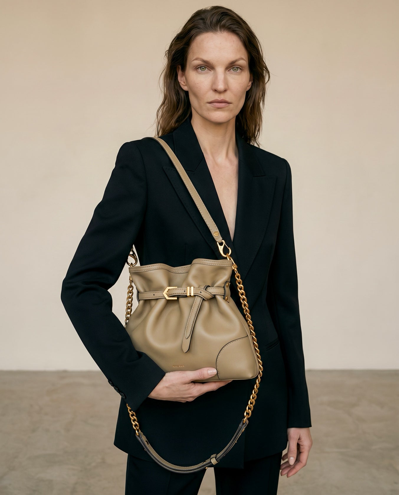 Pereira Mini bag in light olive leather worn on the shoulder