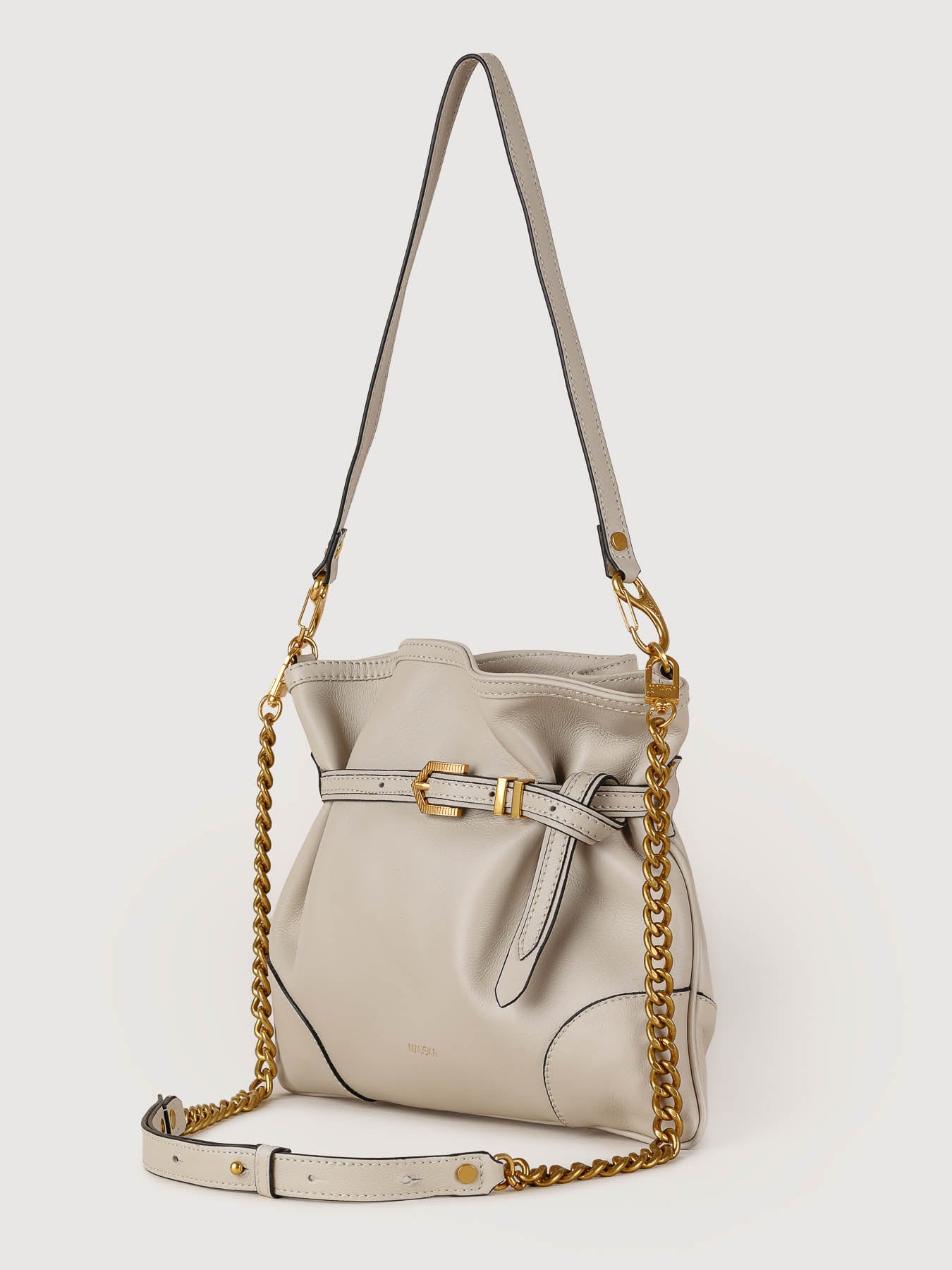 Side view of Pereira Mini pearl grey leather bag showing its structured silhouette.