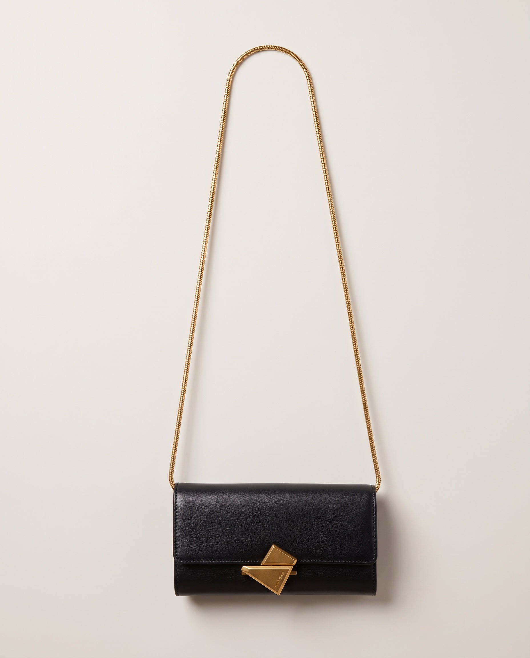 VEGA Clutch in black color leather with gold-tone chain, front view