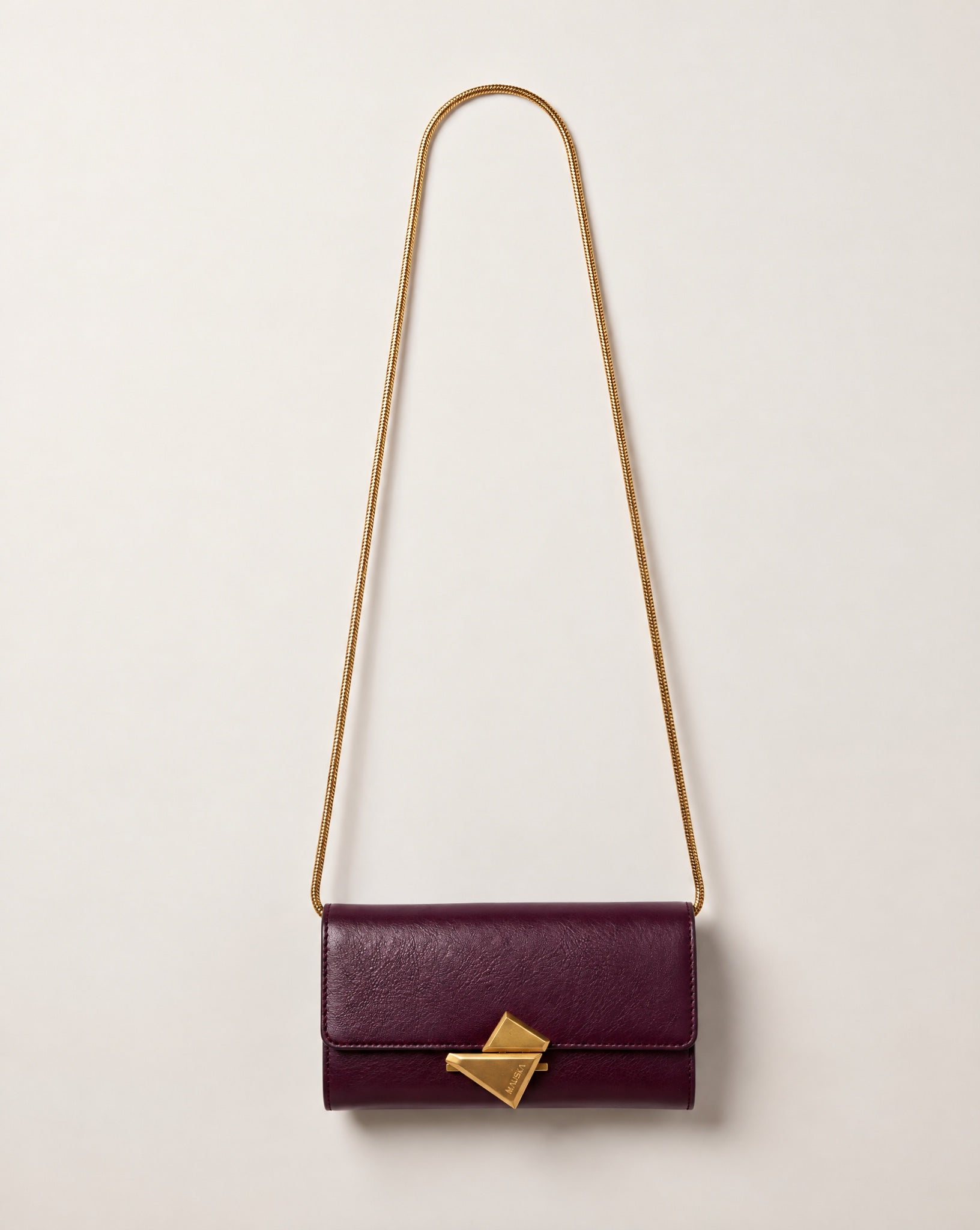 VEGA Clutch in burgundy color leather with gold-tone chain, front view