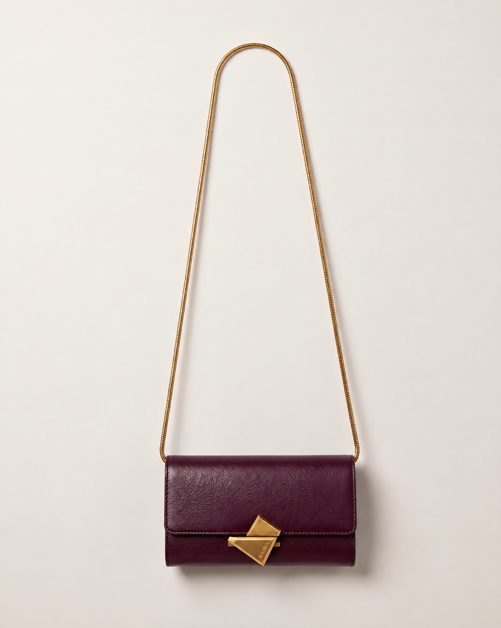 VEGA Clutch in burgundy color leather with gold-tone chain, front view