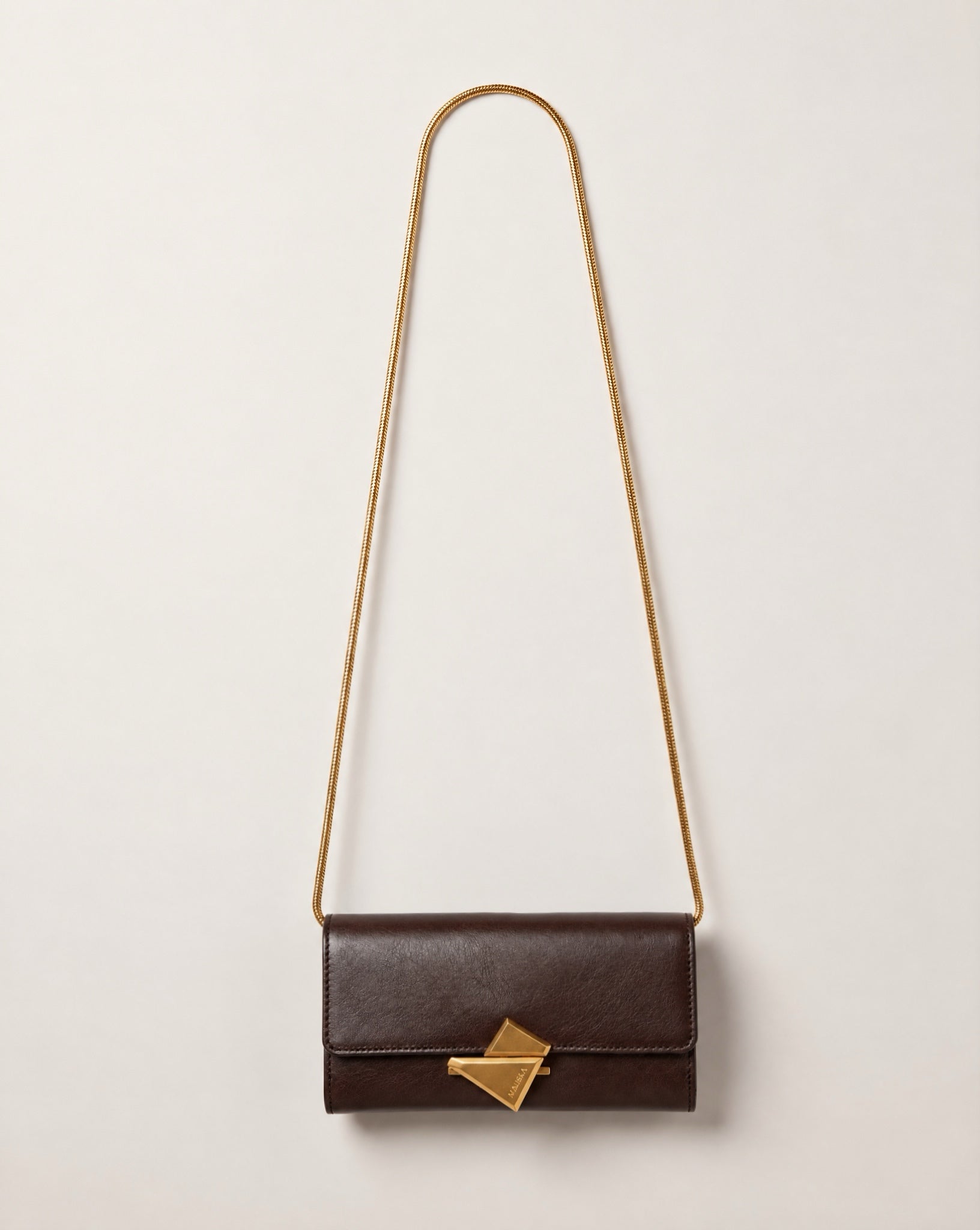 VEGA Clutch in tobacco color leather with gold-tone chain, front view