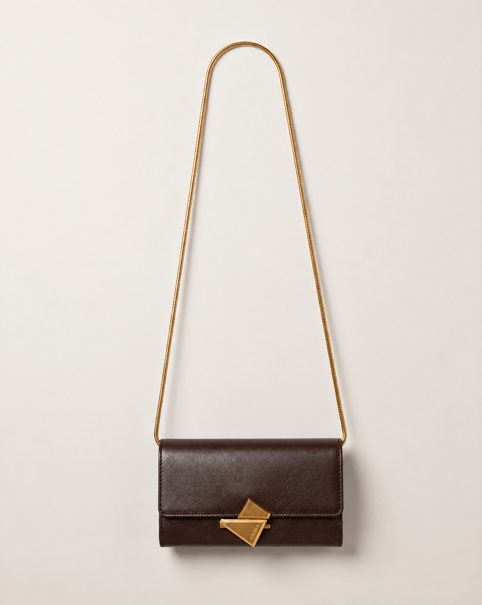 VEGA Clutch in tobacco color leather with gold-tone chain, front view