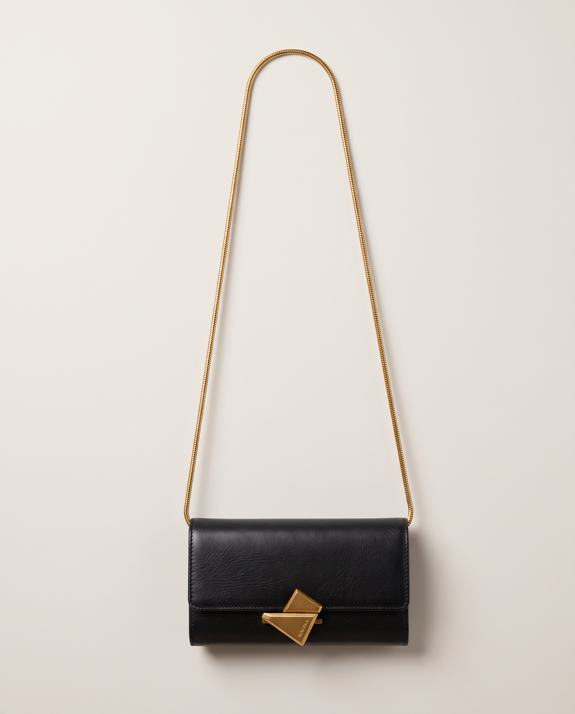 VEGA Clutch in black leather with gold-tone chain, front view